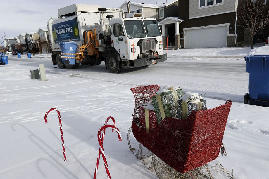 Dewey Edwards, equipment operator for Wasatch Front Waste & Recycling District, collects recycling in Herriman on Wednesday.