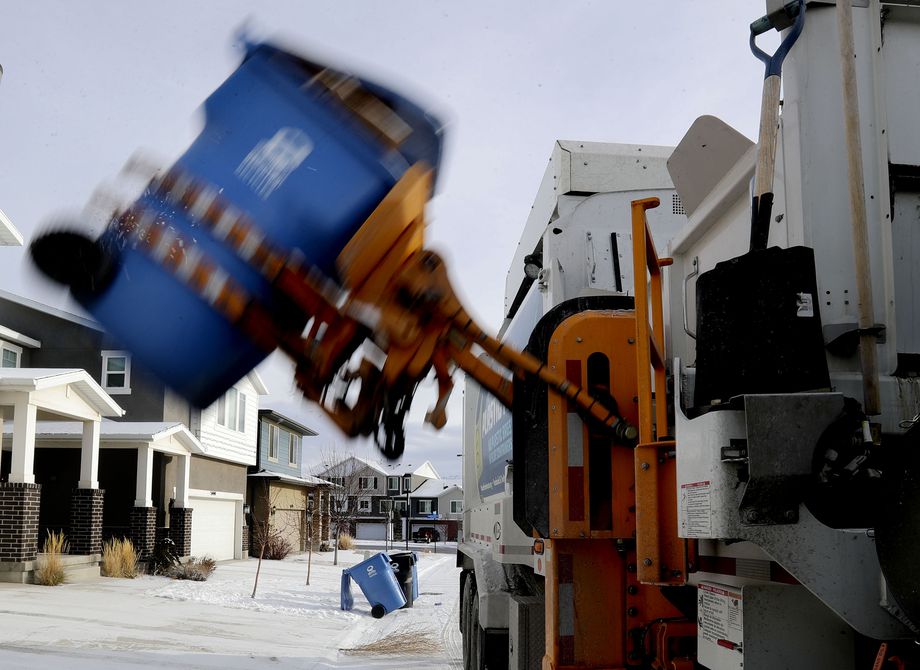 Dewey Edwards, equipment operator for Wasatch Front Waste & Recycling District, collects recycling in Herriman on Wednesday.