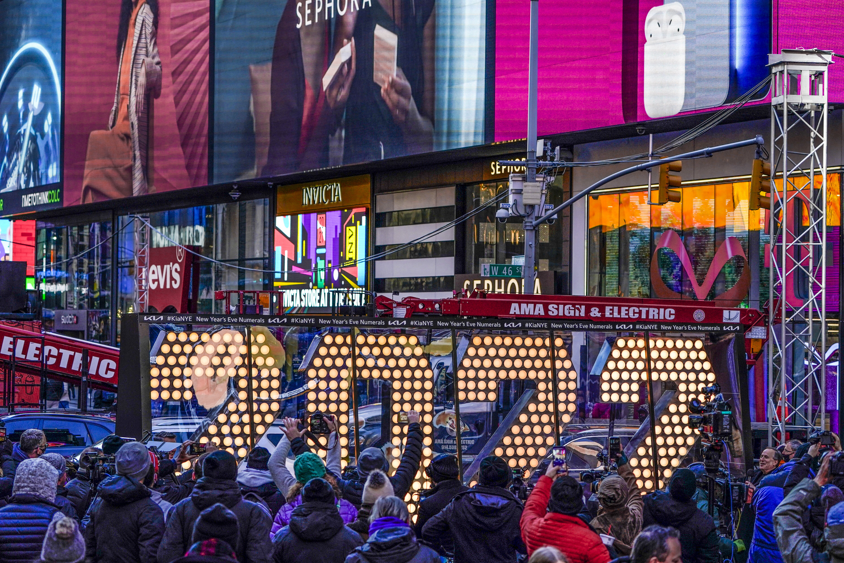 The 2022 sign that will be lit on top of a building on New Year's Eve is displayed in Times Square, New York, Monday.