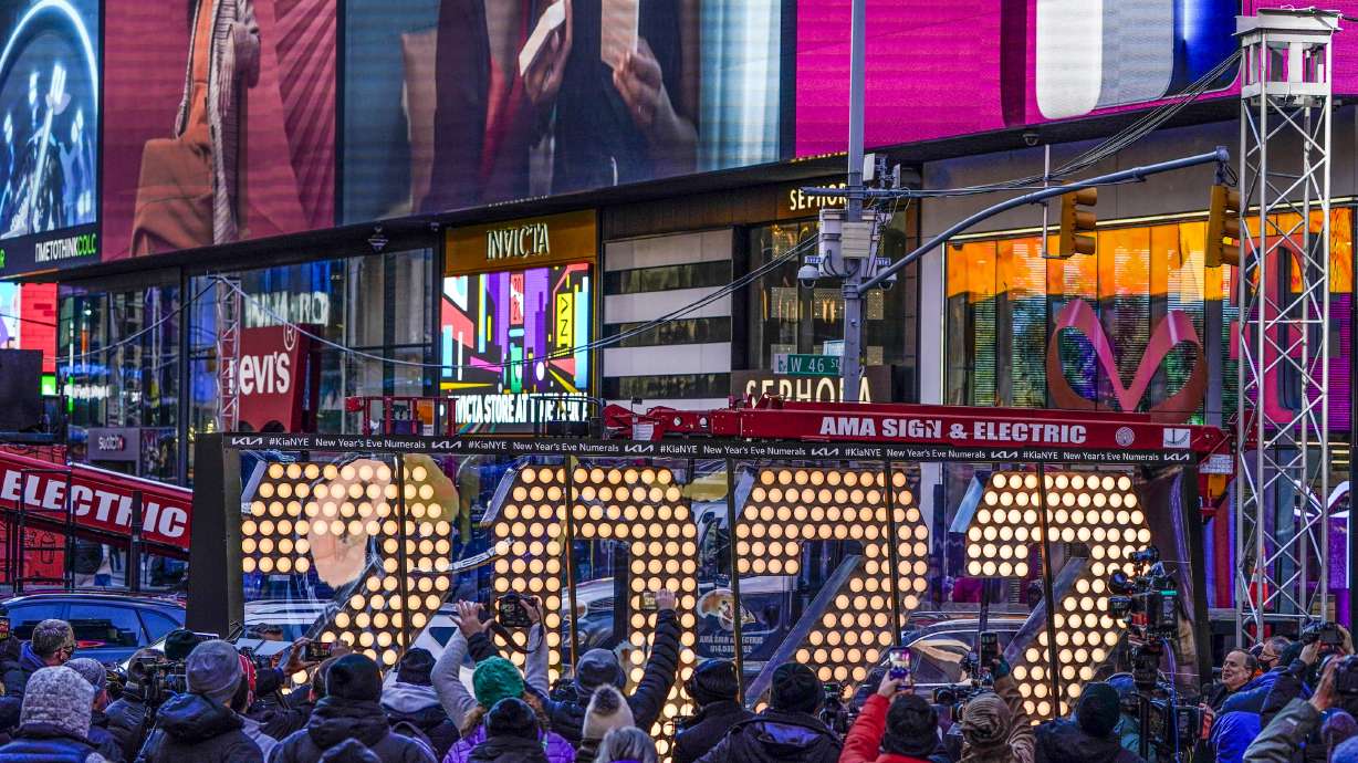 The 2022 sign that will be lit on top of a building on New Year's Eve is displayed in Times Square, New York, Monday.