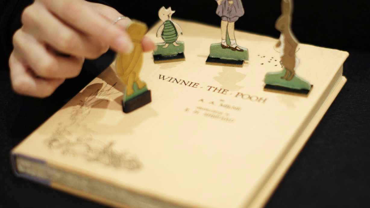 A first U.S. edition of Winnie the Pooh signed by the author A.A. Milne and illustrator E.H. Shepard is displayed in London on Dec. 15, 2008. “Winnie the Pooh” and “The Sun Also Rises” are going public. A.A. Milne’s children’s book and Ernest Hemingway’s novel are among the works from 1926 whose copyrights will expire Jan. 1, 2022, putting them in the public domain in 2022.