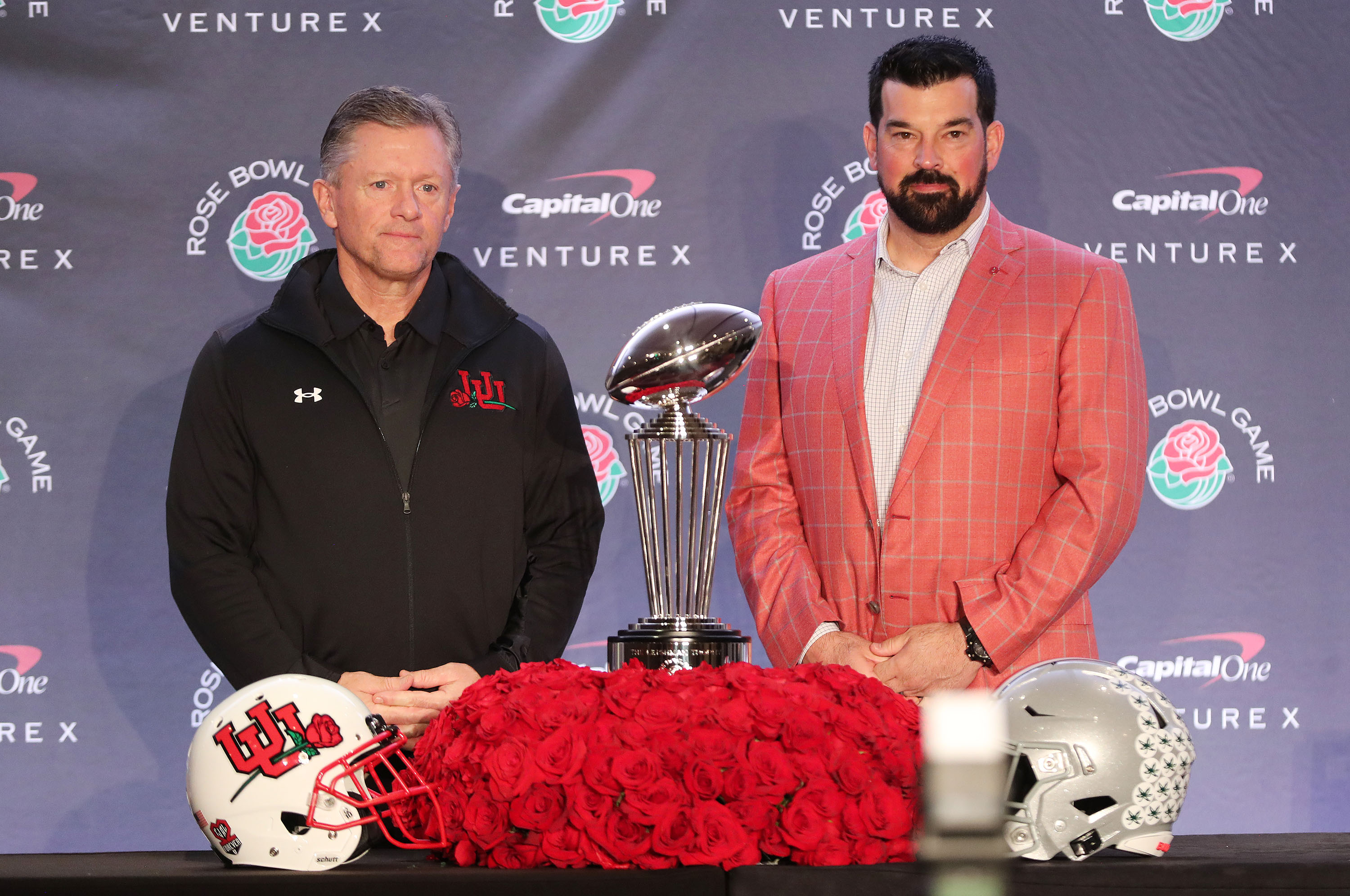 Utah Utes head coach Kyle Whittingham, left, and Ohio State Buckeyes head coach Ryan Day pose with the Rose Bowl trophy during a press conference in Los Angeles on Friday, Dec. 31, 2021.