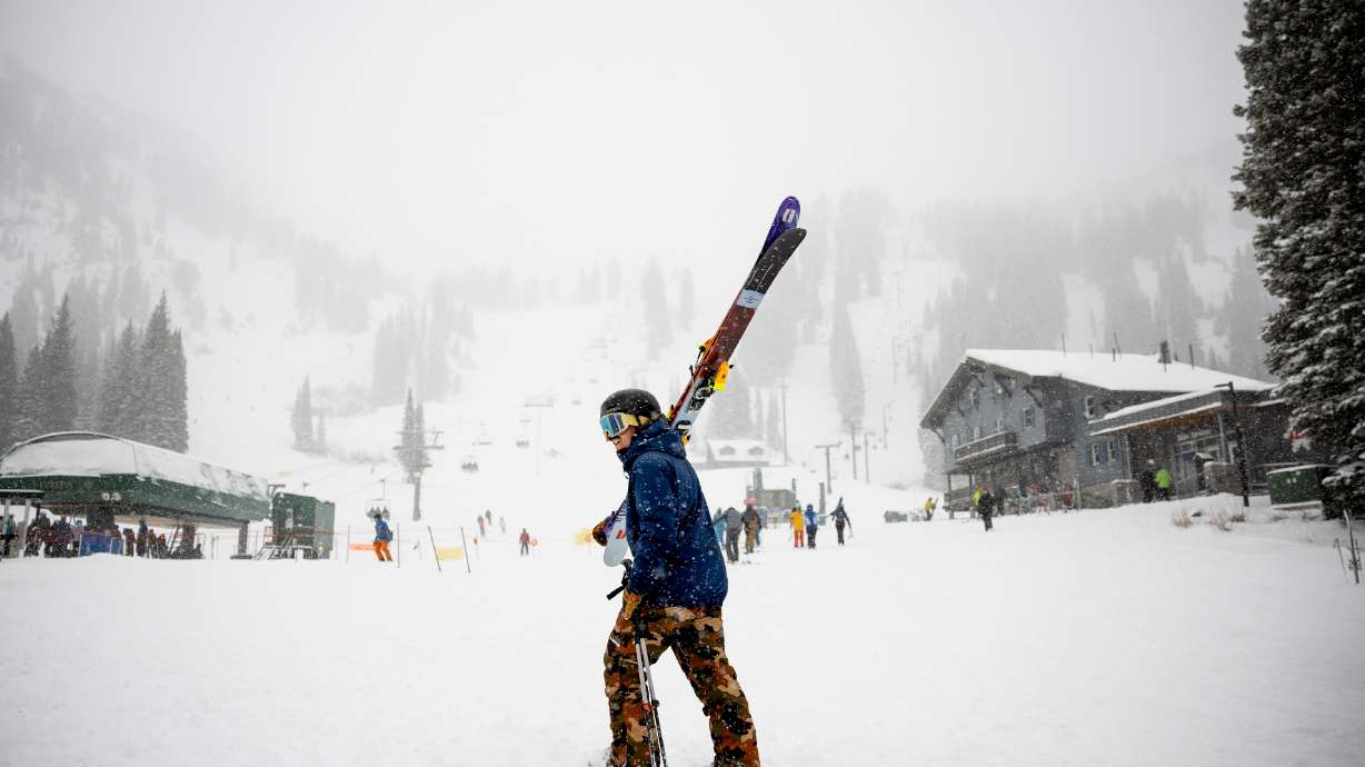 Jay Burrows heads toward the Collins lift at Alta Ski Area as fresh snow falls on Dec. 9. A series of storms since Dec. 9 has Utah's snowpack back above average heading into 2022.