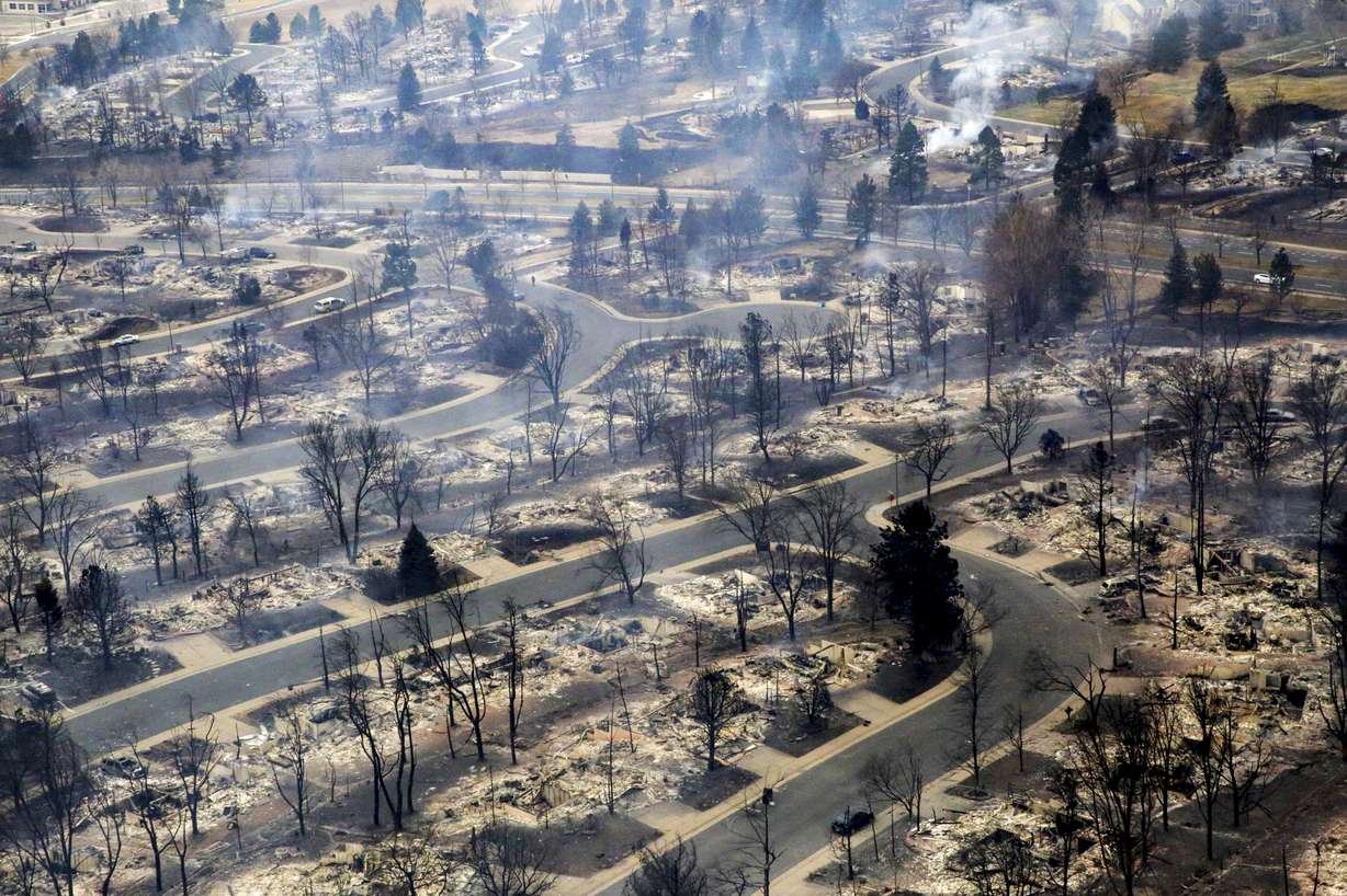 A view of a Boulder County neighborhood that was destroyed by a wildfire is seen from a Colorado National Guard helicopter during a flyover by Gov. Jared Polis on Friday.