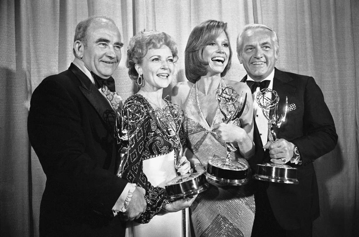 Cast members of the "Mary Tyler Moore Show," Ed Asner, Betty White, Mary Tyler Moore and Ted Knight, pose with their Emmys backstage at the 28th annual Emmy Awards in Los Angeles. Director James Burrows, who died on Friday at age 85, had a hand in directing the show to its artistic heights.