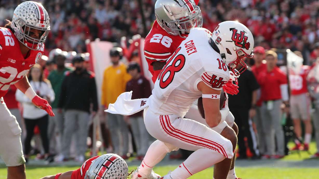 Utah Utes wide receiver Britain Covey (18) scores a touchdown during the Rose Bowl in Pasadena on Saturday, Jan. 1, 2022. Utah leads 35-21 at half.