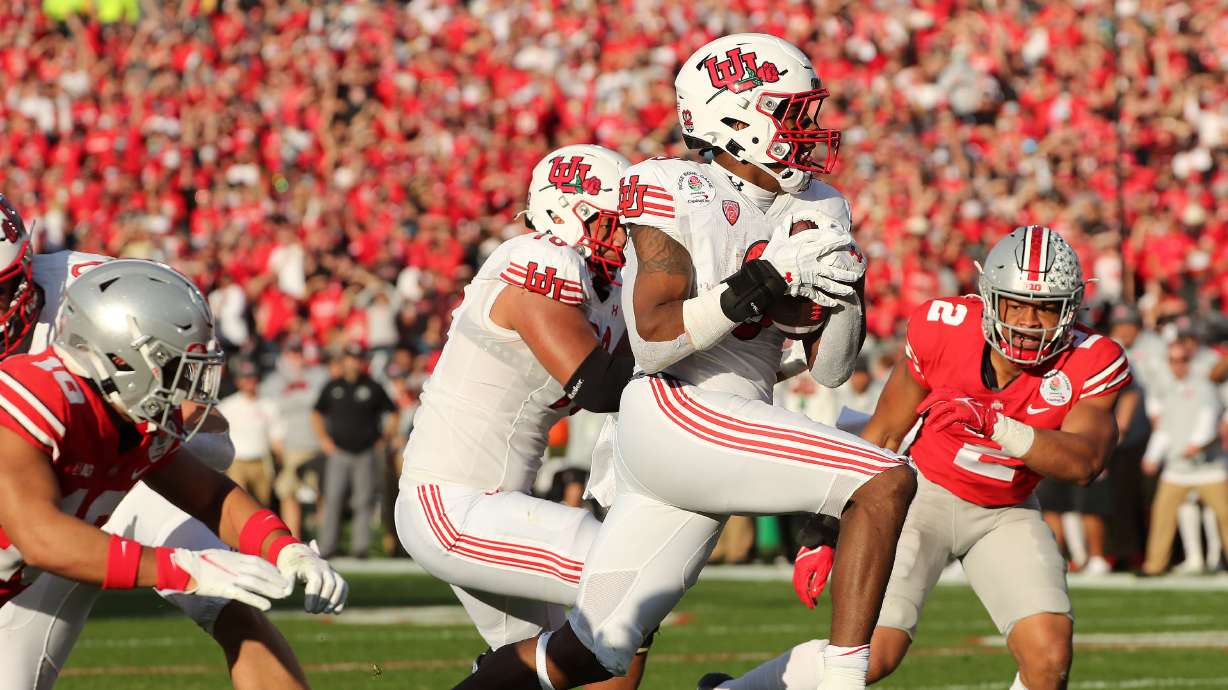 Utah Utes running back Tavion Thomas (9) scores during to the Rose Bowl in Pasadena on Saturday, Jan. 1, 2022. Utah leads 35-21 at half.