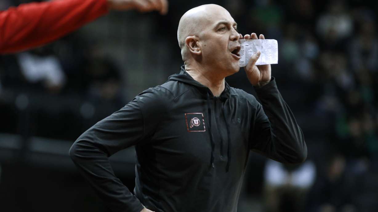 Utah coach Craig Smith calls out to players during the first half of an NCAA college basketball game against Oregon in Eugene, Ore., Saturday, Jan. 1, 2022.