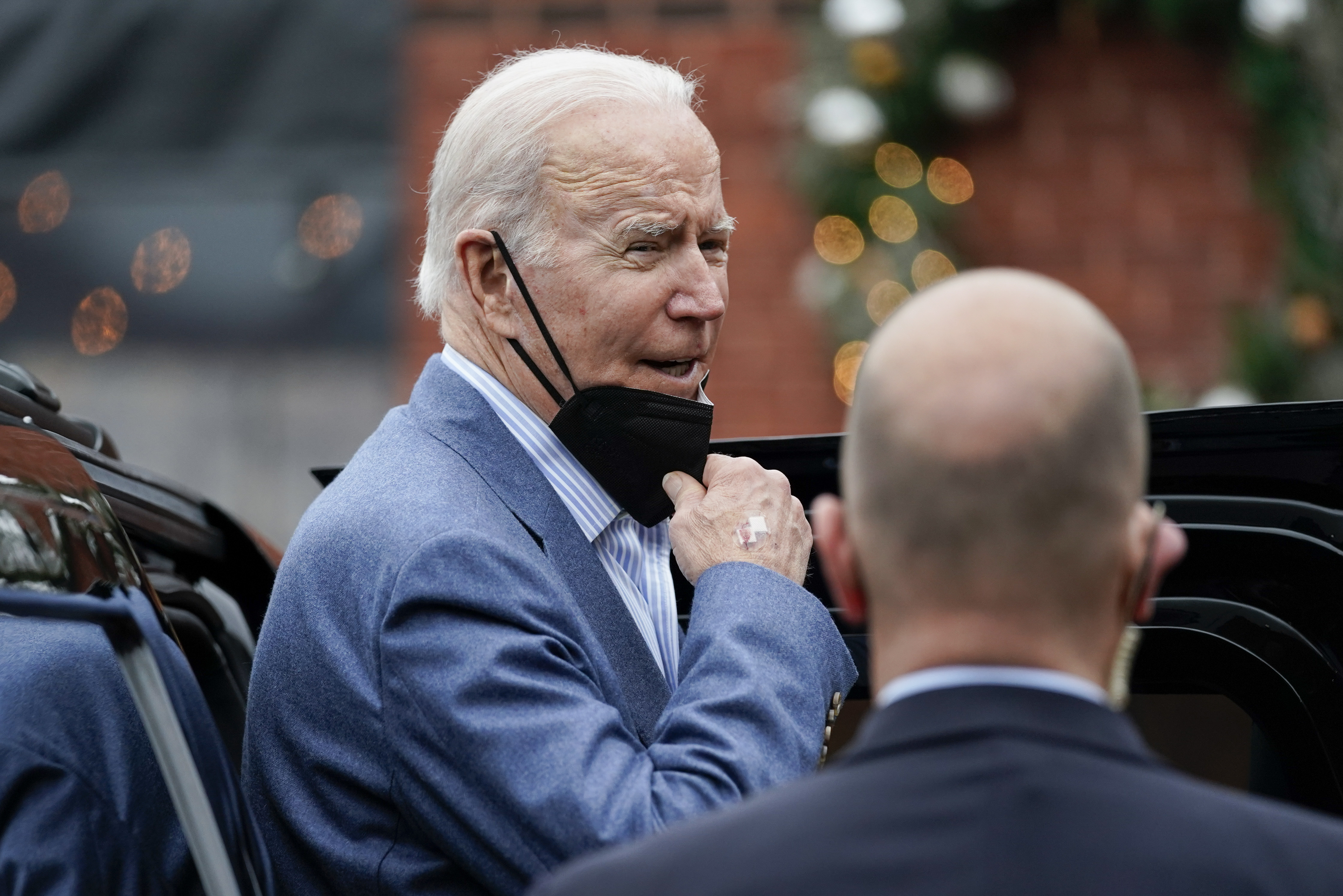 President Joe Biden speaks to the media as gets into his motorcade after having New Year's Eve lunch with first lady Jill Biden in Wilmington, Del., Friday. President Joe Biden promised that the U.S. and allies will act "decisively" if Russia further invades Ukraine.