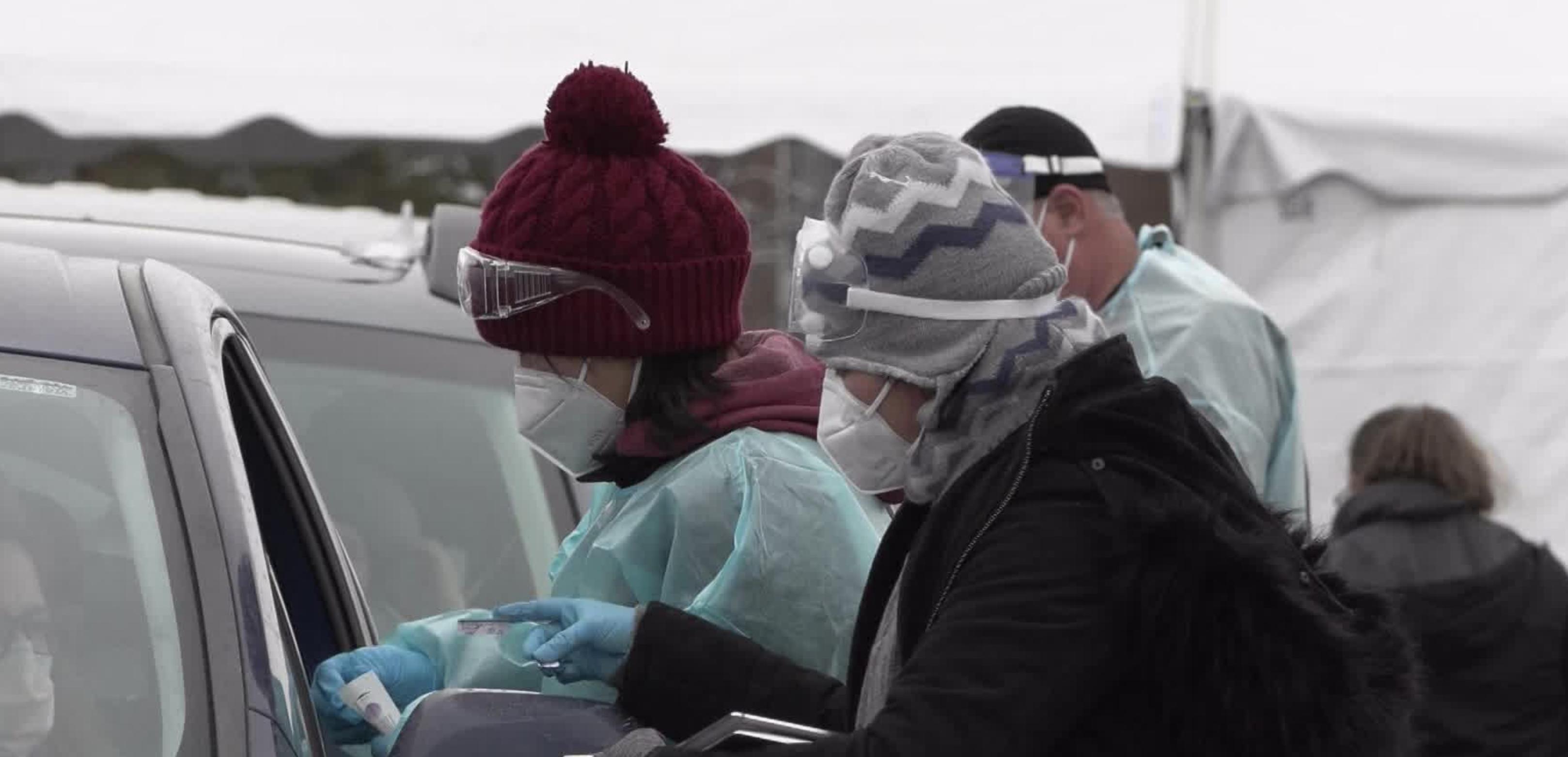 Bundled up health care workers administer COVID-19 tests. Utah health officials on Monday reported 5,504 new COVID-19 cases since Friday, as well as 18 additional deaths.