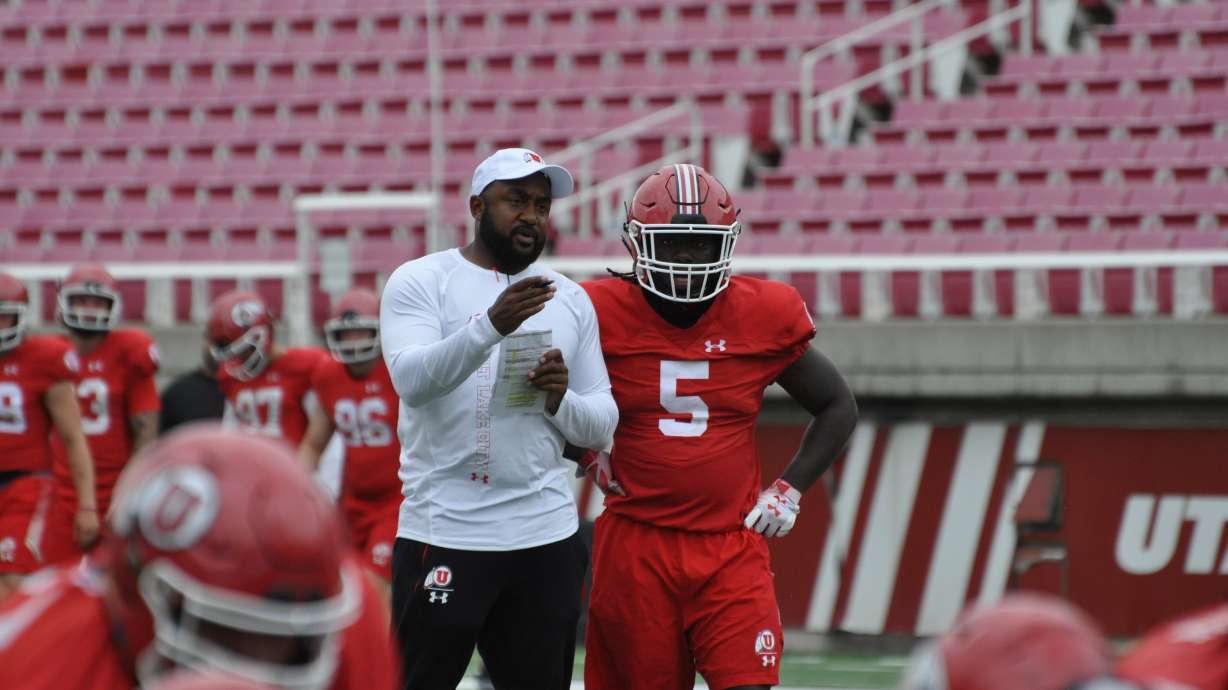 Utah running back Jordan Wilmore, right, looks on during fall camp on Wednesday, Aug. 7, 2019, at Rice-Eccles Stadium.