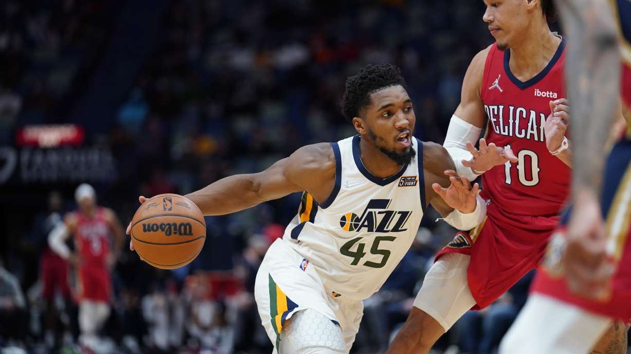 Utah Jazz guard Donovan Mitchell (45) drives to the basket against New Orleans Pelicans center Jaxson Hayes (10) in the second half of an NBA basketball game in New Orleans, Monday, Jan. 3, 2022. The Jazz won 115-104.
