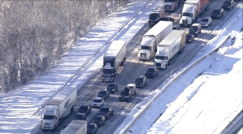 Motorists sit stranded on Interstate 95 in Northern, Va., on Tuesday. Hundreds of motorists were stranded all night in snow and freezing temperatures along a 50-mile stretch of Interstate 95 after a crash involving six tractor-trailers in Virginia, where authorities were struggling Tuesday to reach them.