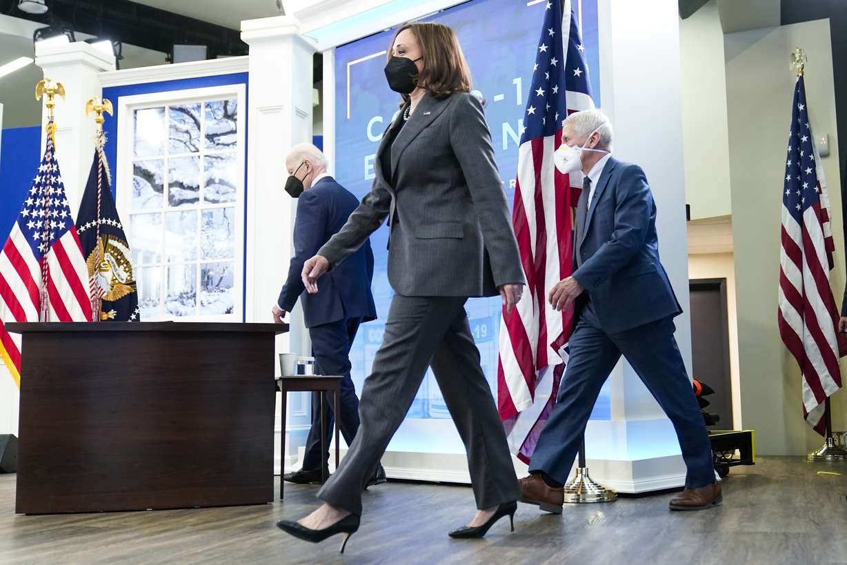 President Joe Biden, Vice President Kamala Harris and Dr. Anthony Fauci, director of the National Institute of Allergy and Infectious Diseases and chief medical adviser to the president, arrive to meet with the White House COVID-19 Response Team on the latest developments related to the Omicron variant in the South Court Auditorium in the Eisenhower Executive Office Building on the White House Campus in Washington, Tuesday, Jan. 4, 2022.