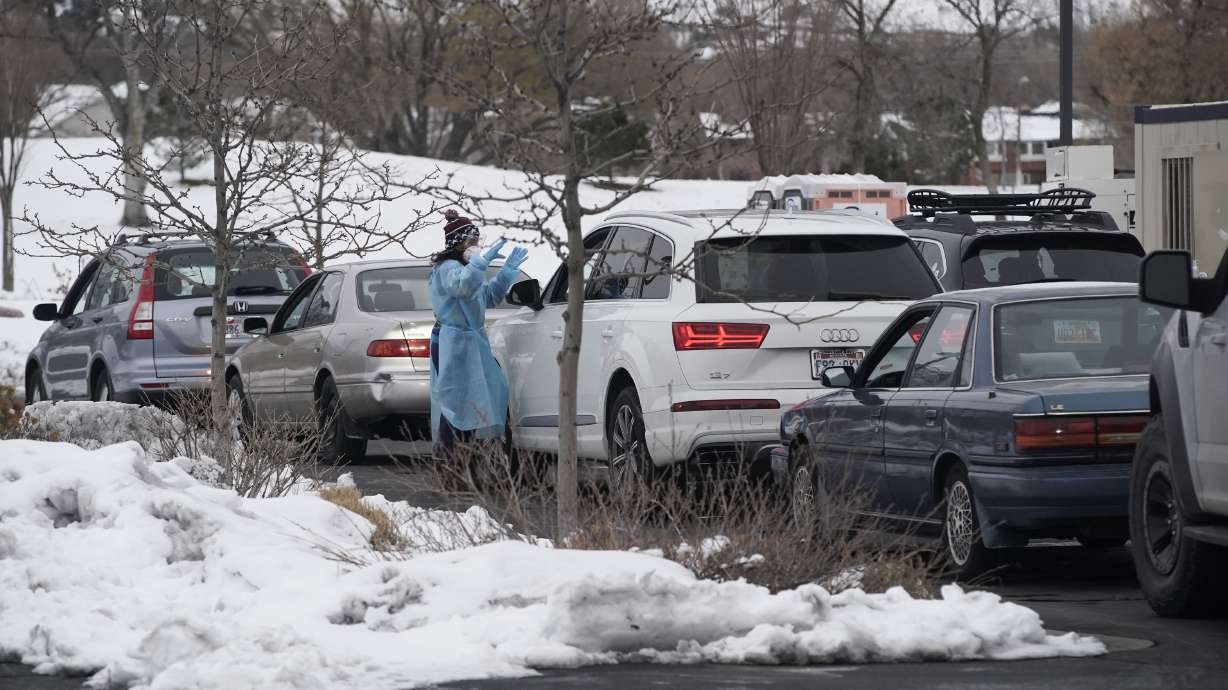 A medical worker attends a passenger in a vehicle at a COVID-19 testing site at the Draper Senior Center in Draper on Monday. Utah health officials reported 4,661 new COVID-19 cases and seven deaths on Tuesday. Hospital officials also warned that the situation is likely to get worse before it gets better.