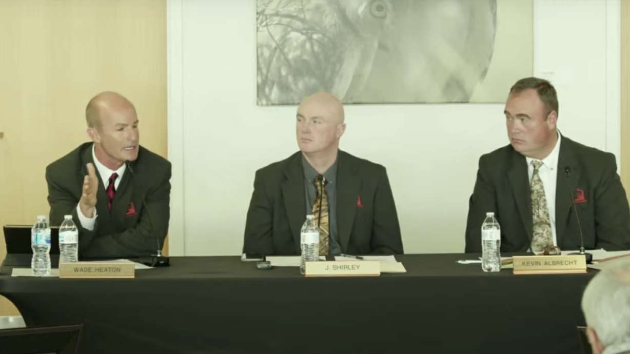 Utah Wildlife Board member Wade Heaton, left, speaks during a meeting on Jan. 4, 2022. Heaton, who resigned from the board last year, faces 11 charges tied to an illegal baiting scheme, according to court documents.