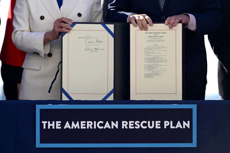 House Speaker Nancy Pelosi and Senate Majority Leader Chuck Schumer display the "American Rescue Plan" during the enrollment ceremony following the passage of President Joe Biden's $1.9 trillion coronavirus disease relief bill on Capitol Hill in Washington, U.S., March 10, 2021. Wednesday, some lawmakers are weighing in on new COVID-19 funding.