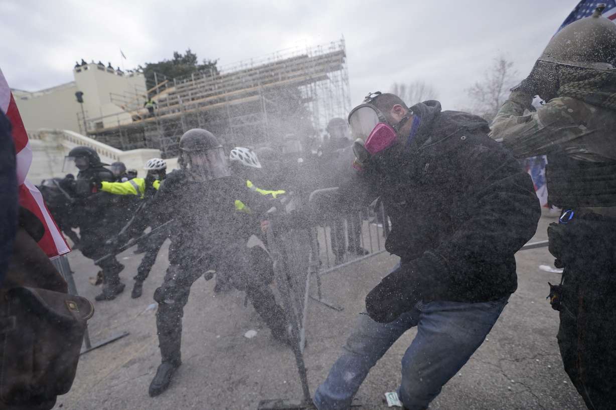 Supporters of then-President Donald Trump try to break through a police barrier at the Capitol in Washington on Jan. 6, 2021.