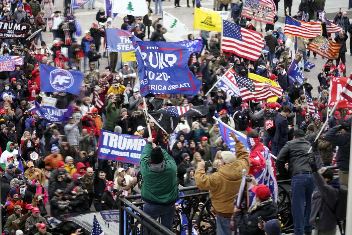 Rioters gather outside the U.S. Capitol in Washington, on Jan 6, 2021.