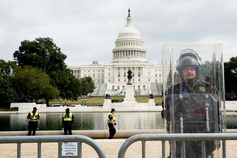 A riot police officer stands guard during a rally in support of defendants being prosecuted in the Jan. 6 attack on the Capitol, in Washington on Sept. 18, 2021.