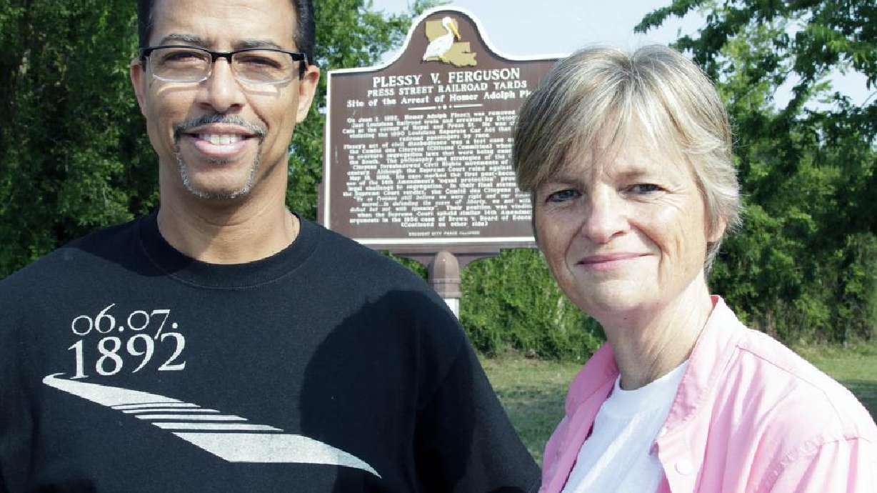Keith Plessy and Phoebe Ferguson, descendants of the principals in the Plessy v. Ferguson court case, pose for a photograph in front of a historical marker in New Orleans, on Tuesday, June 7, 2011. On Wednesday, Louisiana's governor posthumously pardoned Homer Plessy.