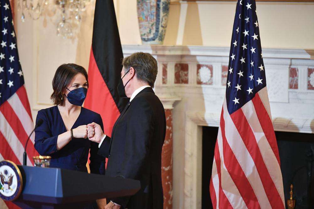 German Foreign Minister Annalena Baerbock fist bumps with Secretary of State Antony Blinken at the State Department, Wednesday in Washington.