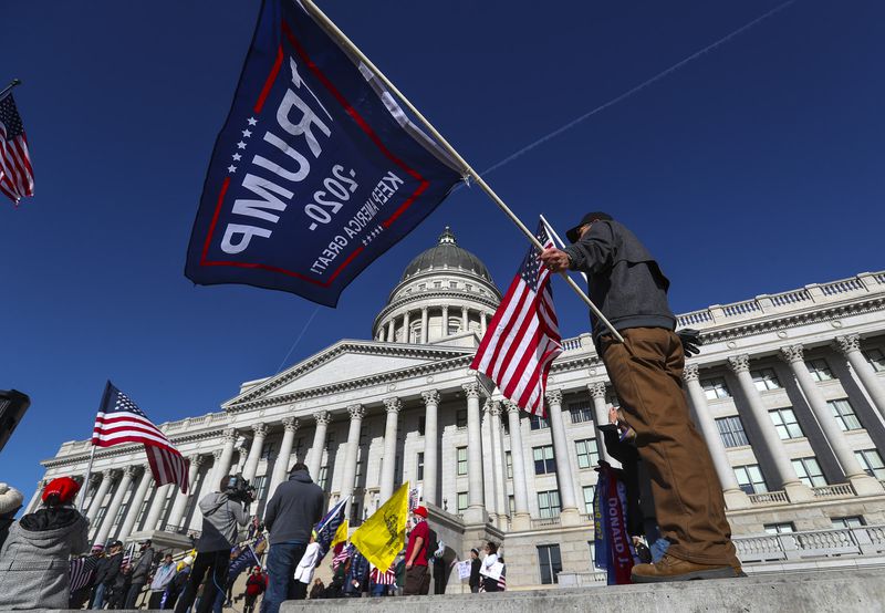 Supporters of President Donald Trump rally on the steps
of the Capitol in Salt Lake City on Wednesday, Jan. 6,
2021.