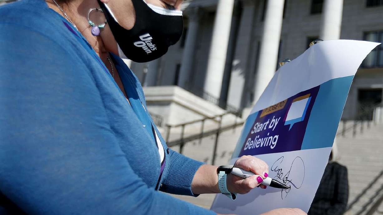 Rep. Angela Romero, D-Salt Lake City, signs a Start by Believing pledge to kick off Sexual Assault Awareness Month at the Capitol in Salt Lake City on Wednesday, April 7, 2021.