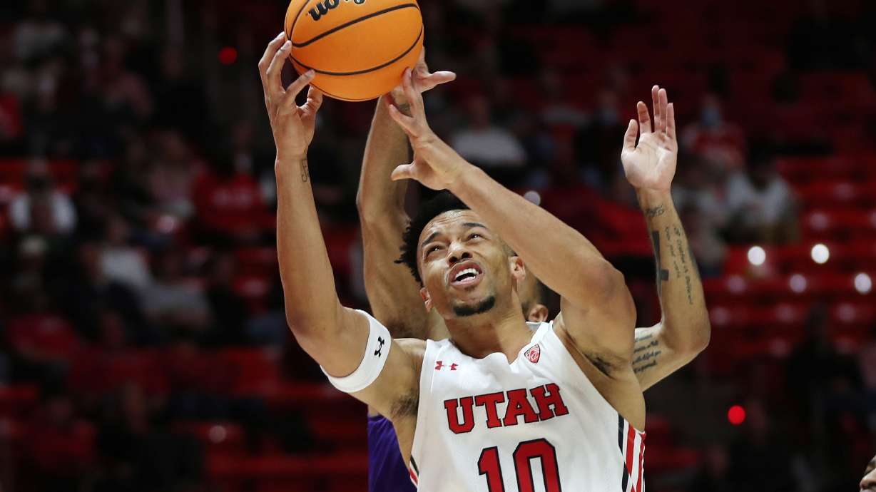 Utah Utes guard Marco Anthony (10) drive son the Washington Huskies in Salt Lake City on Thursday, Jan. 6, 2022.