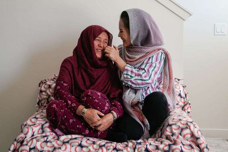 Afghan refugee Hawa Sultani, left, talks with her
daughter, Shazia Kakaie, while posing for a portrait at their house in North Salt Lake on Tuesday, Nov. 23, 2021. Following the Taliban takeover of Kabul, Afghanistan, Shazia was separated from her husband, Azim. They were reunited in Utah on Oct. 30.