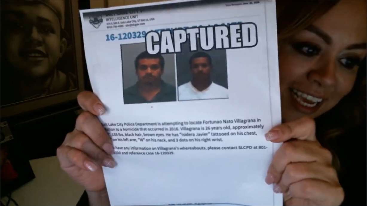 Ashley Gustin holds up a photo of Fortunato Nato Villagrana, 27, a man charged with shooting and killing her 16-year-old son, Paris, in 2016. Villagrana was arrested in Mexico and extradited to Salt Lake City late Thursday.