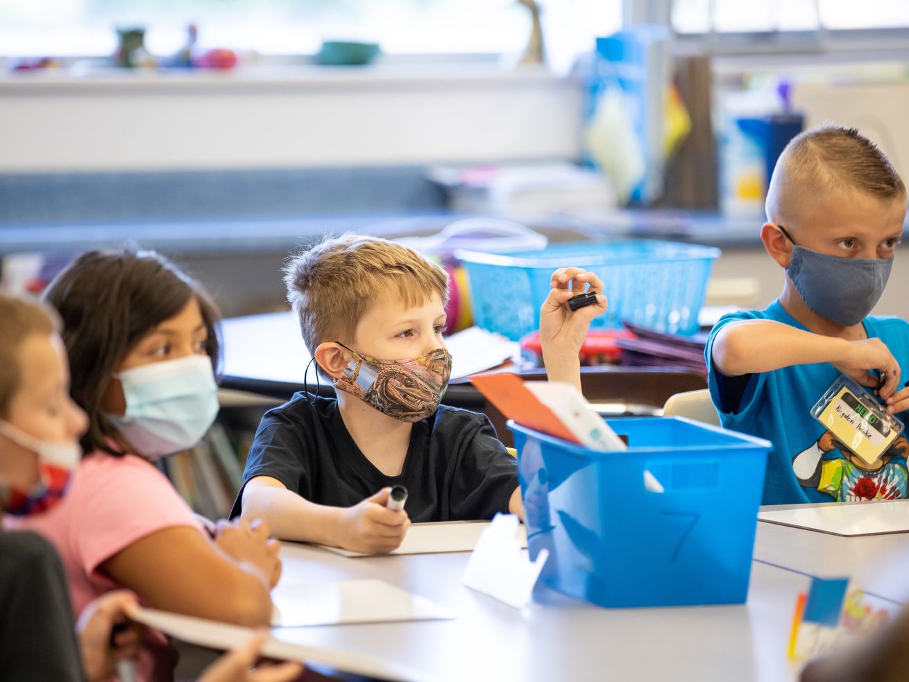 Josh Bird, Leslie Mancilla, Kaiden Smolka and Kingston Pedokie wear masks in their third grade class at Nibley Park School in Salt Lake City on Aug. 24. A Salt Lake County mask mandate, which takes effect at 12:01 a.m. Saturday and will remain in place until 5 p.m. on Feb. 7, will apply to schools, Salt Lake County Health Department spokesman Nicholas Rupp said.