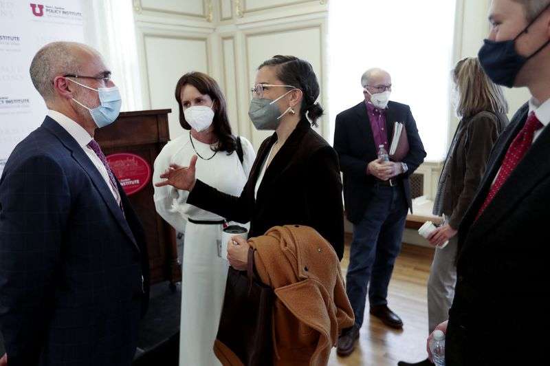 Arthur Brooks, the William Henry Bloomberg professor of
the practice of public leadership at the Harvard Kennedy School and
professor of management practice at the Harvard Business School,
left, speaks with Catherine Kanter, center, and Salt Lake City
Mayor Erin Mendenhall at a Kem C. Gardner Policy Institute
symposium at the Thomas S. Monson Center in Salt Lake City on
Friday.