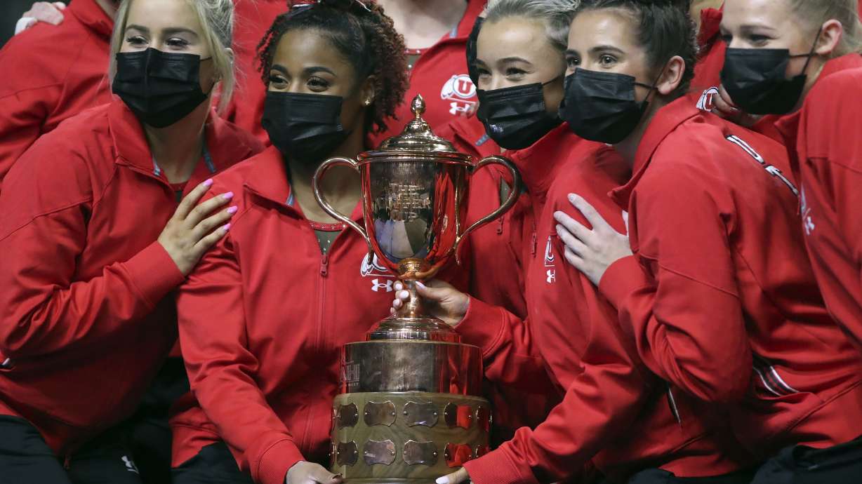The University of Utah celebrates winning the Rio Tinto Best of Utah NCAA gymnastics meet against Brigham Young University, Utah State University and Southern Utah University at the Maverik Center in Salt Lake City on Friday, Jan. 7, 2022.