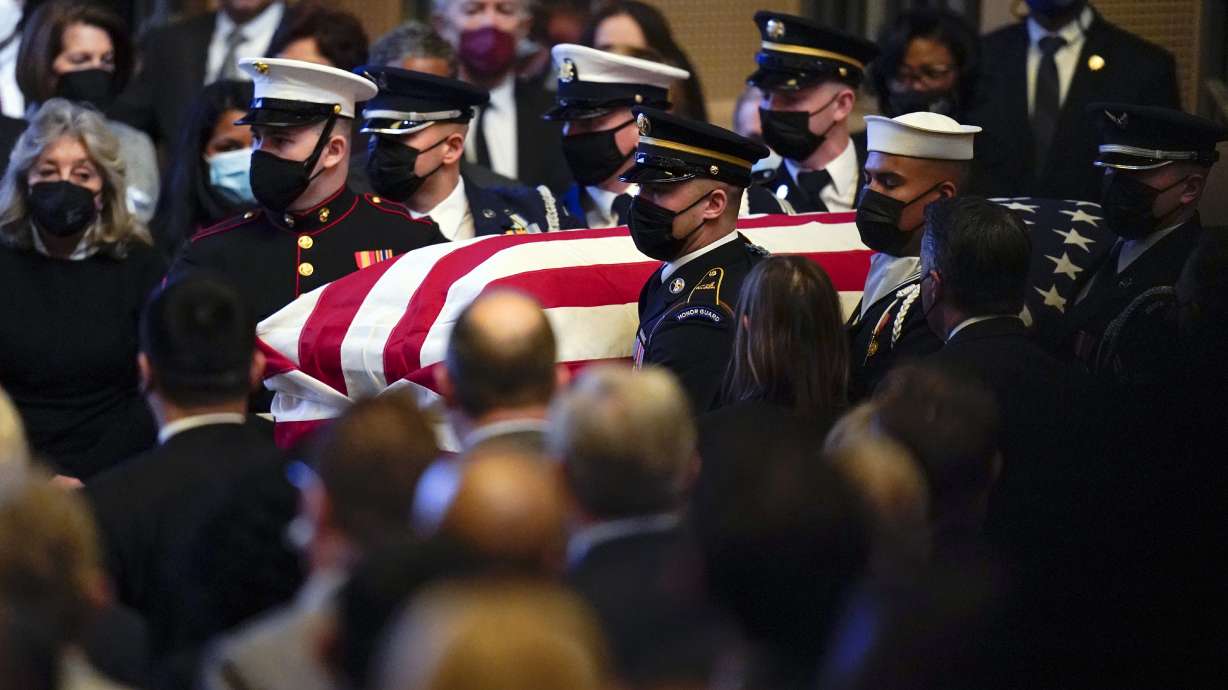 A military honor guard carries the flag-draped casket of former Senate Majority Leader Harry Reid during a memorial service at the Smith Center in Las Vegas, on Saturday.
