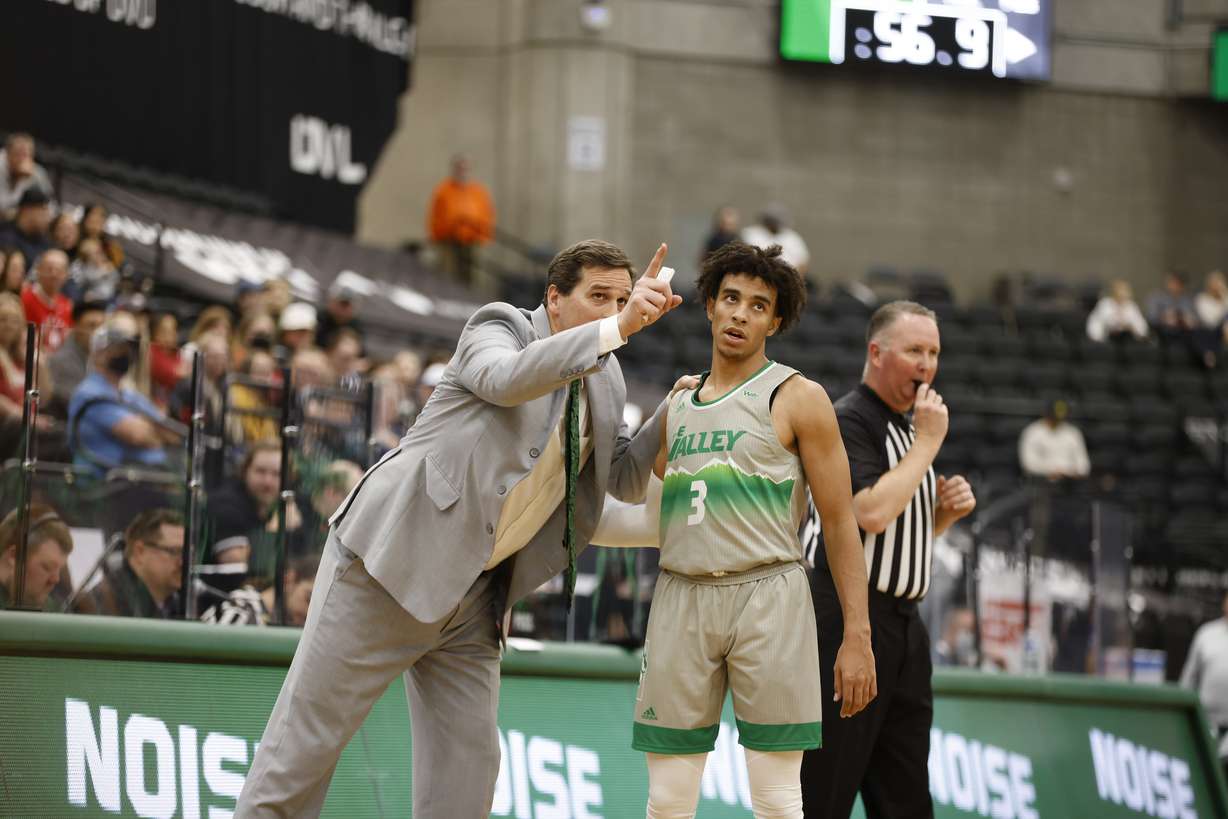 Utah Valley coach Mark Madsen with point guard Blaze Nield during the Wolverines' 79-71 win over in-state rival Dixie State, Saturday, Jan. 8, 2022 at the UCCU Center in Orem.
