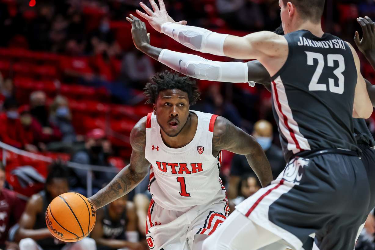 Utah Utes guard David Jenkins Jr. (1) drives against Washington State Cougars defenders during the game at the Huntsman Center in Salt Lake City on Saturday, Jan. 8, 2022.