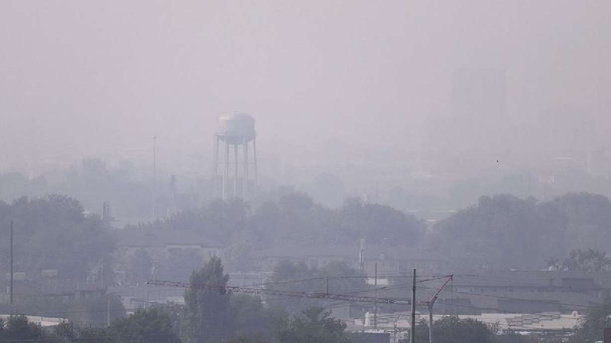 Smoke from wildfires in California hangs in the air over the Salt Lake Valley on Aug. 21, 2020. Scientists predict pollution will not only get worse but improvements made under the Clean Air Act are being reversed due to high temperatures and prolific wildfires.