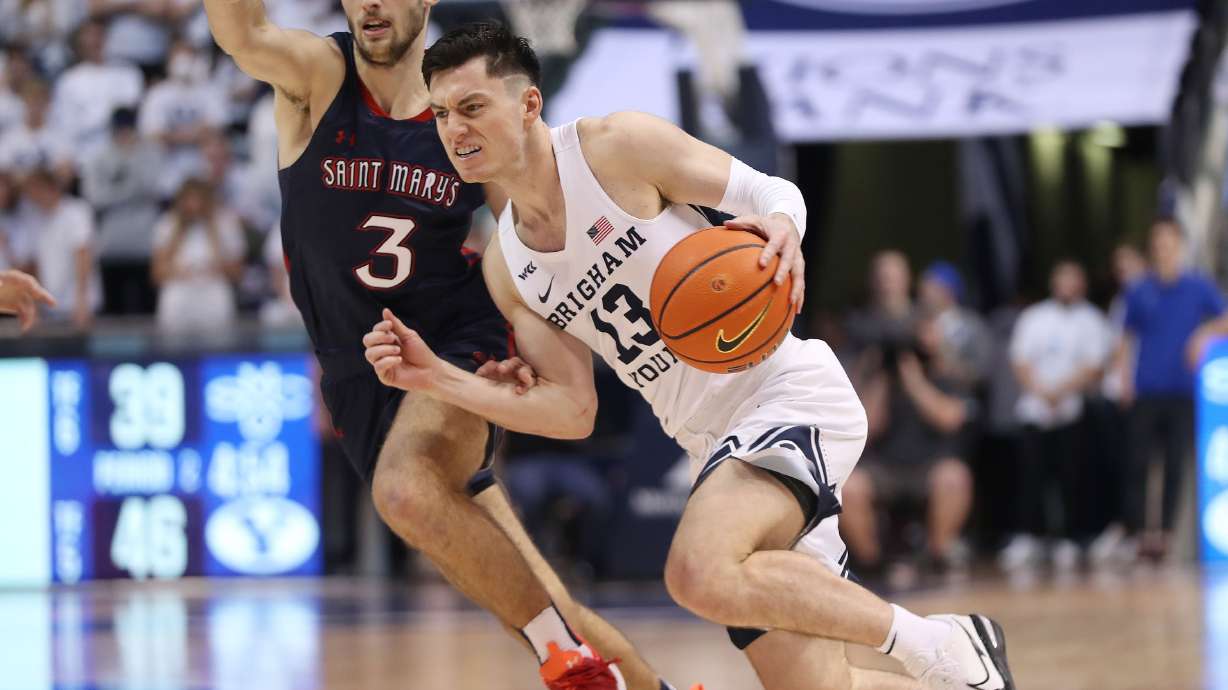 Brigham Young Cougars guard Alex Barcello (13) drives on Saint Mary's Gaels guard Augustas Marciulionis (3) in Provo on Saturday, Jan. 8, 2022. Saint Mary's won the rematch in Moraga, California.