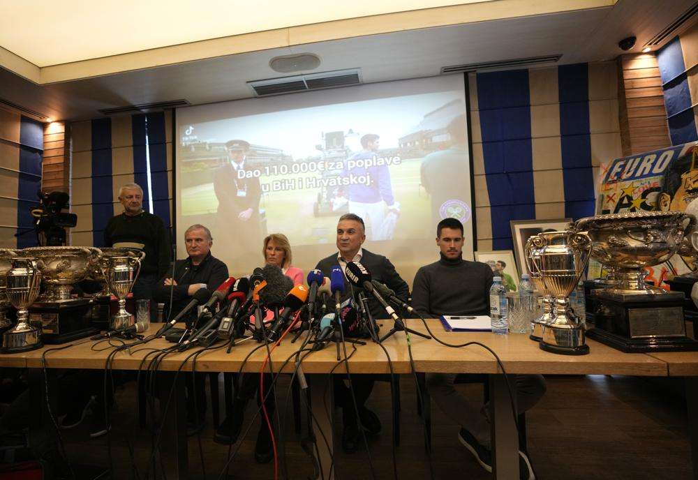 Serbia's Novak Djokovic's father Srdjan, second right, brother Djordje, right, mother Dijana, second left, and uncle Goran, left, attend a press conference in Belgrade, Serbia, Monday. Tennis star Novak Djokovic on Monday won a court battle to stay in Australia to contest the Australian Open despite being unvaccinated against COVID-19.