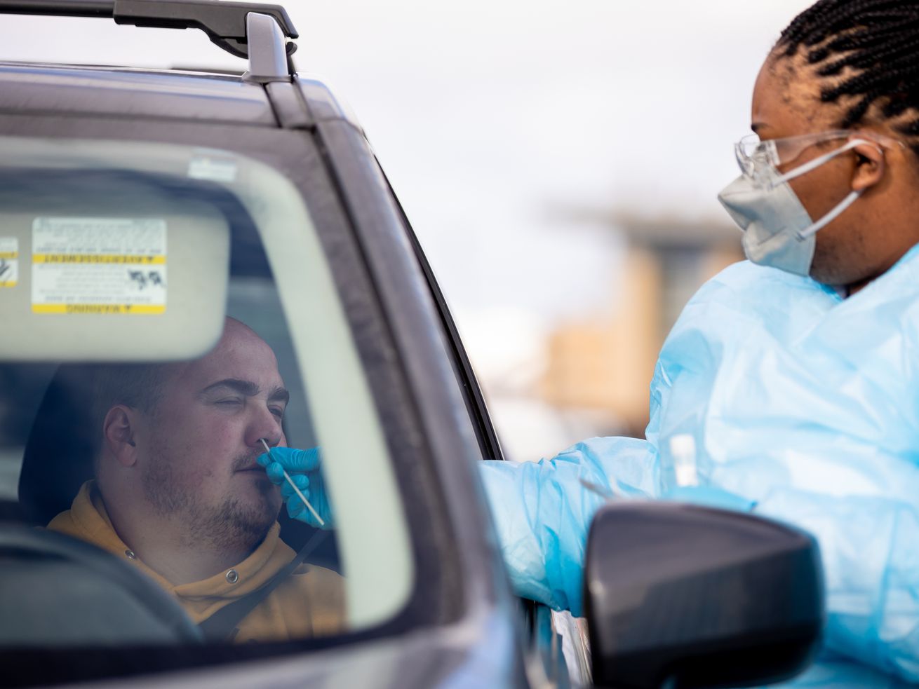 Gabriel Rosito gets a COVID-19 test administered by health care worker Miracle Wright at City Hall in Herriman on Thursday, Jan. 6. Utah health officials reported a record 9,813 new COVID-19 cases on Tuesday, as well as 15 deaths. 
