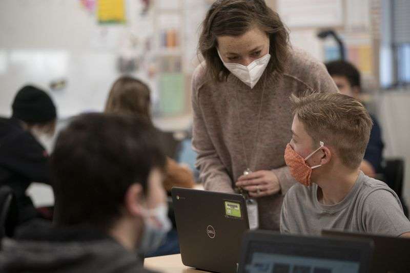 Eighth grade students and their teacher wear masks
during their dual language class at Mount Jordan Middle School in
Sandy on Monday, Jan. 10, 2022, as Salt Lake County has issued a
30-day mask order.