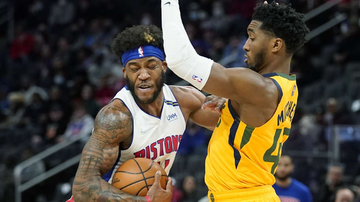 Detroit Pistons forward Saddiq Bey runs into Utah Jazz guard Donovan Mitchell (45) during the first half of an NBA basketball game, Monday, Jan. 10, 2022, in Detroit.