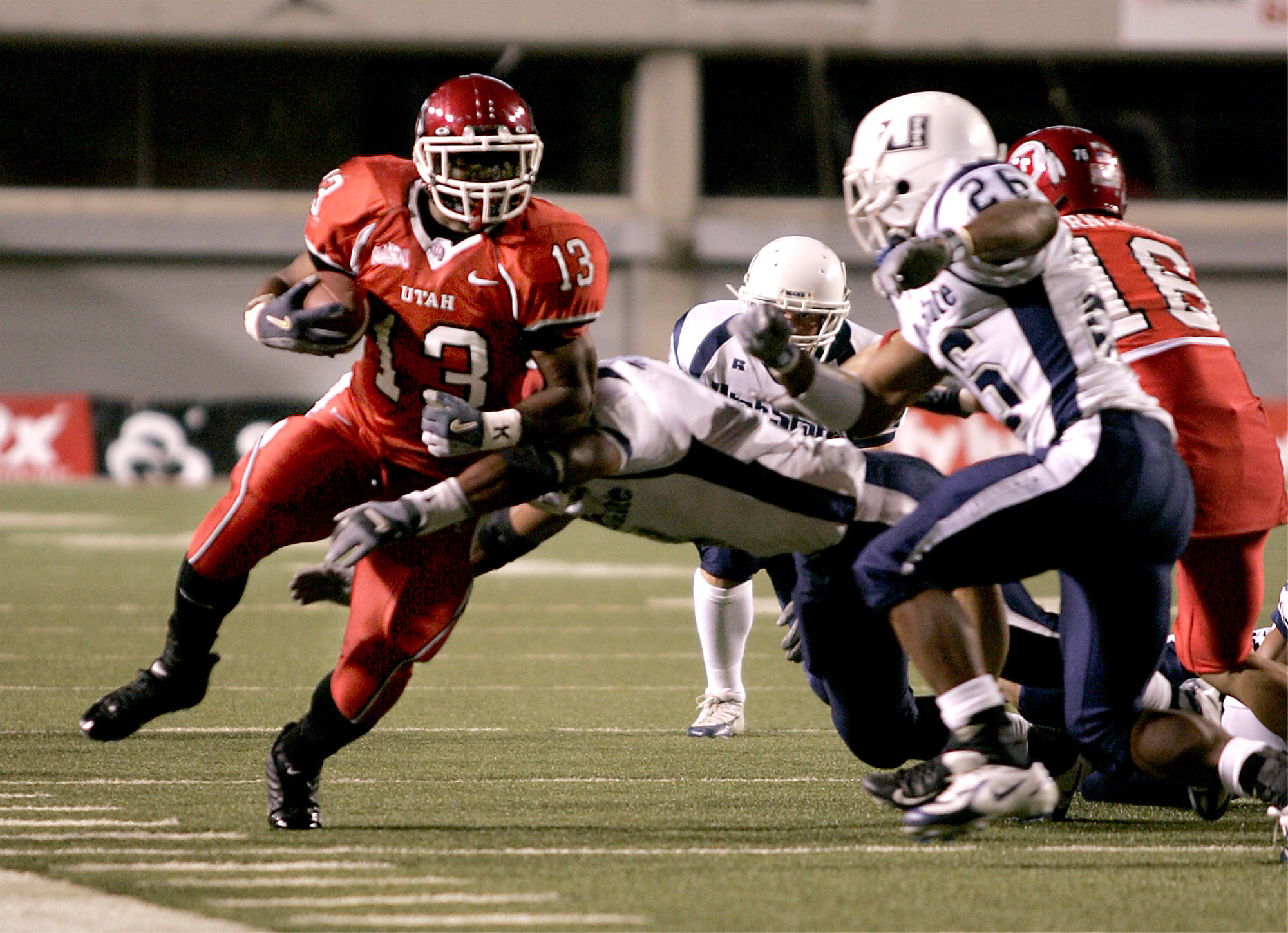 Quinton Ganther breaks a tackle for a first down in the secound half of the Utes victory over Utah State.