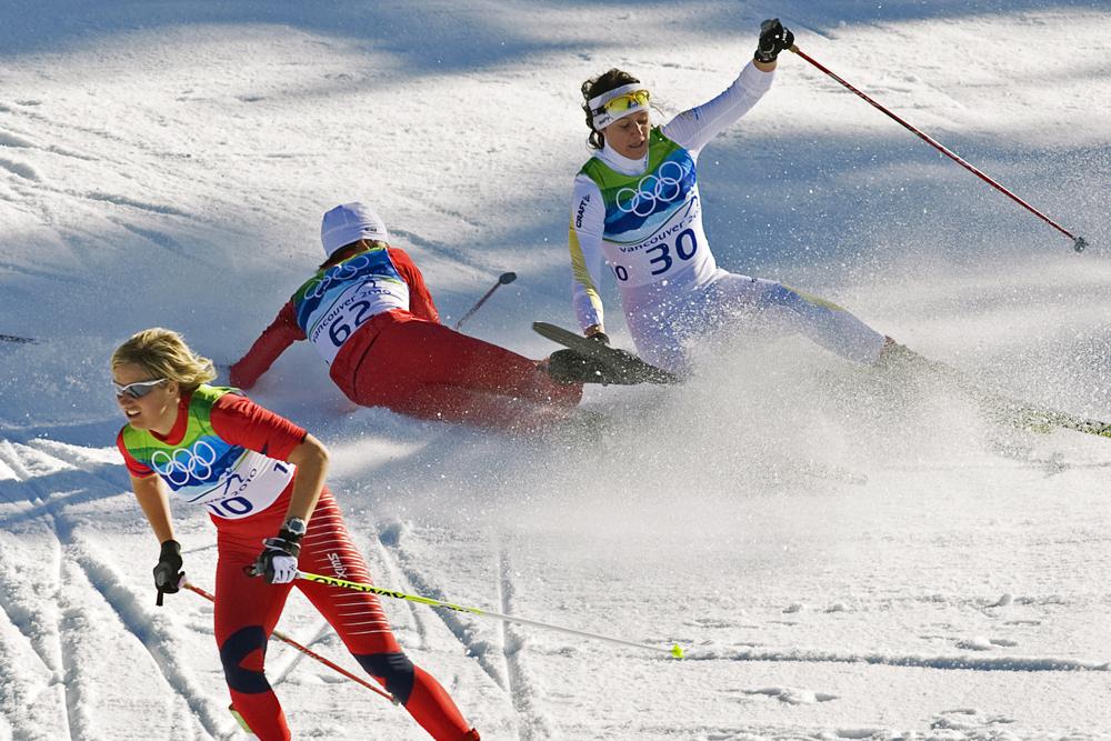 Norway's Vibeke Skofterud, left, escapes a crash involving Sweden's Norgren Johansson, right, and Poland's Paulina Maciuszek in the women's 15-kilometer pursuit cross country skiing event at Whistler Olympic Park on Feb. 19, 2010, at the 2010 Vancouver Olympic Winter Games in Whistler, B.C. 