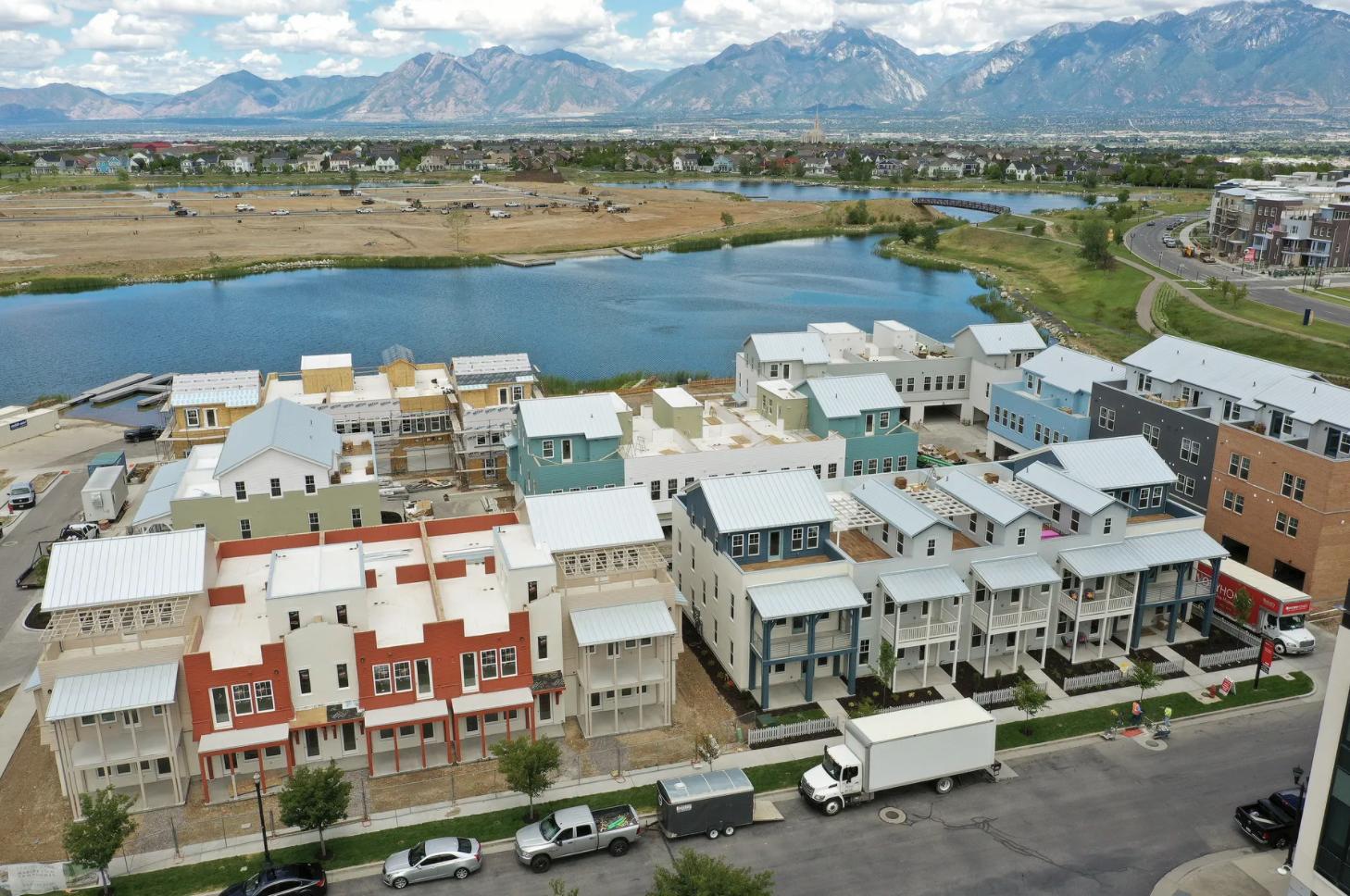 Construction continues on Daybreak Marina Townhomes at Marina Village near Oquirrh Lake in South Jordan on June 17, 2020.  On Tuesday, the group's Larry H. Miller Real Estate portfolio company announced plans to acquire Utah residential construction company Destination Homes.

