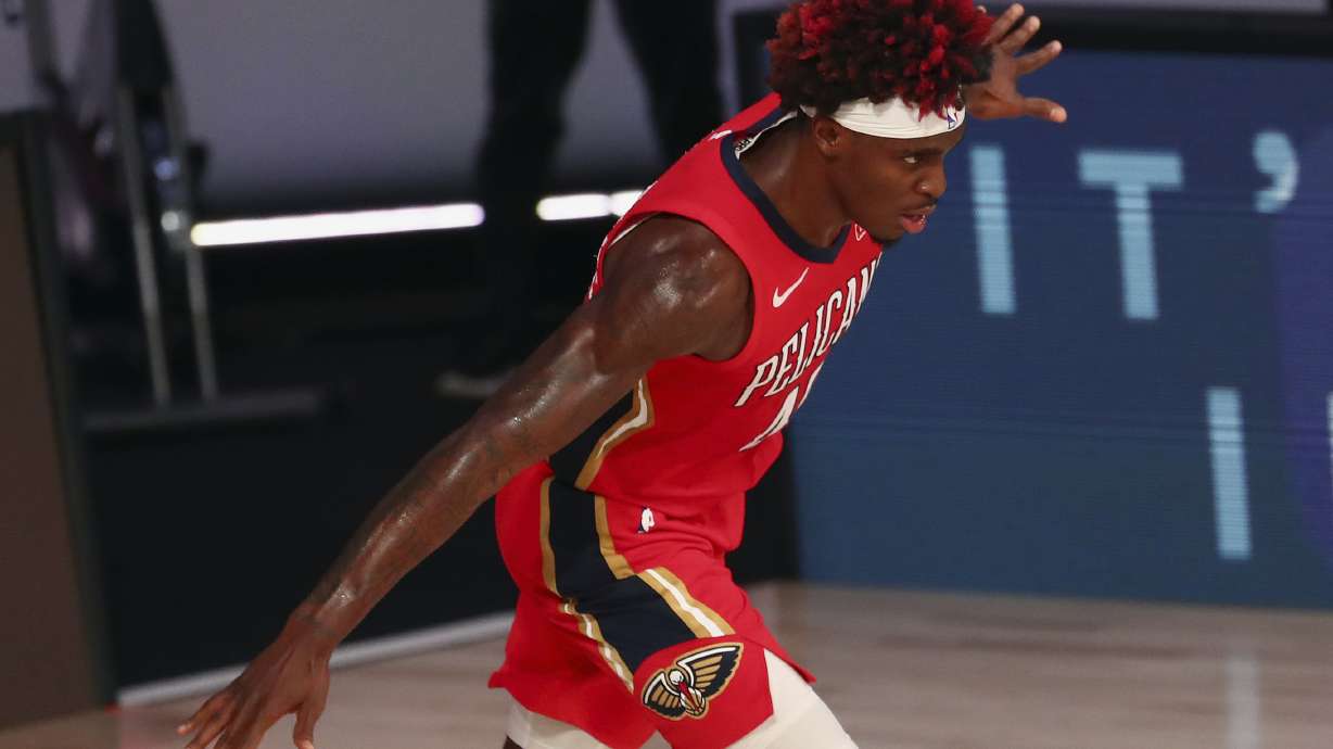 New Orleans Pelicans forward Zylan Cheatham reacts after dunking against the Orlando Magic during the second half of an NBA basketball game Thursday, Aug. 13, 2020, in Lake Buena Vista, Fla.