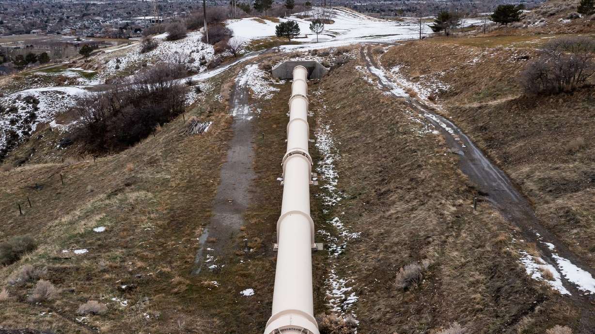 A section of the Alpine Aqueduct runs above ground
where it crosses a fault in the hills above Orem on Thursday.