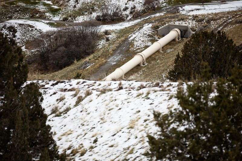 A section of the Alpine Aqueduct runs above ground where it crosses a fault in the hills above Orem on Thursday.