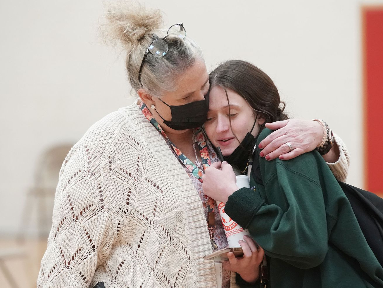Viewmont High School student Aubrey Weeks is hugged by her mother and Davis School District COVID aide Brenda Weeks after her COVID-19 test at the school in Bountiful on Wednesday. The school conducted testing on Wednesday after recent COVID-19 cases among students pushed it past the "test to stay” threshold, where they are required to test students.